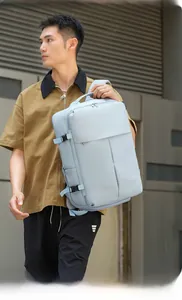 Outdoor shot of light blue large capacity backpack with laptop compartment and side buckles