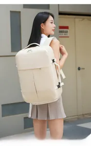 Detail of cream white leather business backpack with metal zippers and buckles