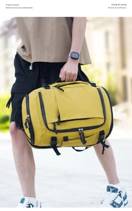 Outdoor street shot of yellow large capacity backpack with multiple zipper pockets