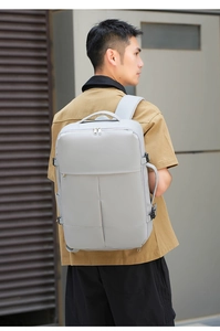 Outdoor shot of a grey high-capacity business backpack with ergonomic padded shoulder straps