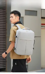Close-up of a large grey business backpack featuring water-resistant fabric and side buckles