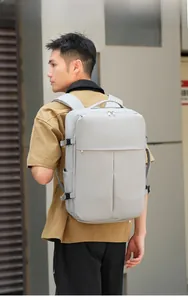 Detail view of water-resistant business backpack with side buckles on male model