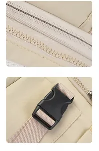 Detail of smooth metal zipper and durable plastic buckle on the beige outdoor backpack