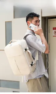 Detail of cream business backpack side buckles and strap on outdoor urban model
