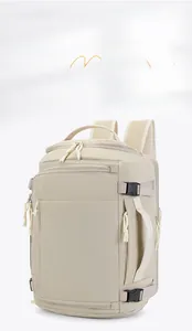 Detail view of large capacity beige travel backpack with waterproof zippers and side straps