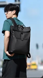 Outdoor shot of a black waterproof business backpack with padded straps for daily commute