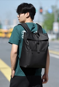 Detail of waterproof black business backpack with buckle closure and matte texture