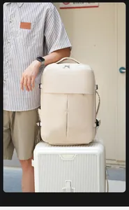 Detail view of cream travel backpack with wide S-straps and side anti-theft buckles