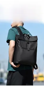 Close-up of waterproof black roll-top business backpack with durable matte nylon finish