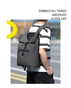 Waterproof dark grey business backpack featuring flip-top buckle and matte finish texture