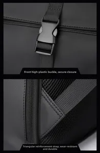 Detail of durable plastic buckle and reinforced triangular stitching on black laptop backpack