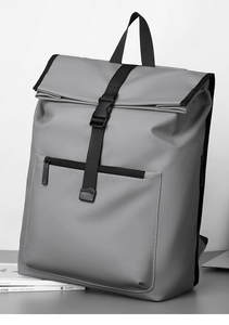 Front view of a grey roll-top waterproof backpack with black straps and buckle closure