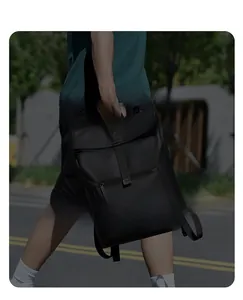 Close-up of waterproof black business backpack featuring durable nylon fabric and buckle detail