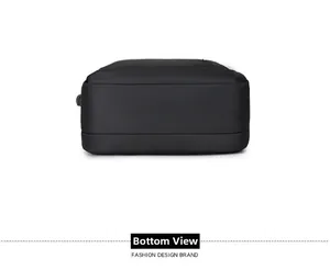Detail view of the reinforced flat bottom of a black expandable business backpack