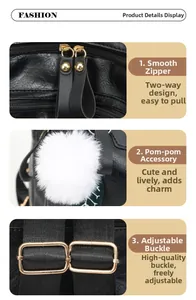 Detail of black leather backpack featuring gold zippers, fur pompom and metal buckles