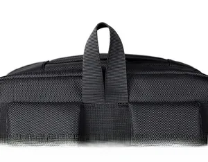 Detail of high-density nylon webbing handle and scratch-resistant honeycomb texture on black bag