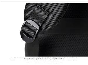 Detail of adjustable shoulder strap with breathable mesh and plastic buckle on black backpack