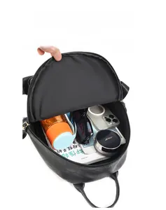 Detail view of the large capacity interior storage in this minimalist black leather backpack