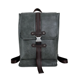 Modern grey faux leather laptop backpack with stylish brown straps and metal buckles