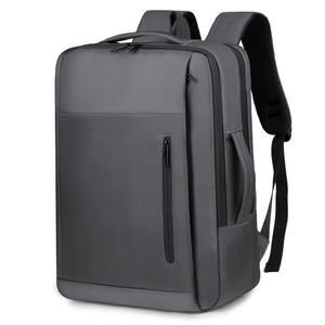 Expandable dark gray business laptop backpack with waterproof fabric and USB charging port