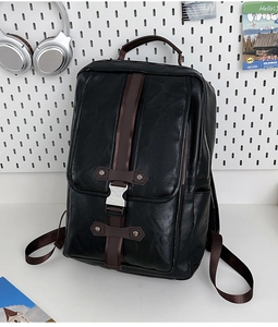 Detail of black PU backpack featuring brown straps and silver metal buckle closure