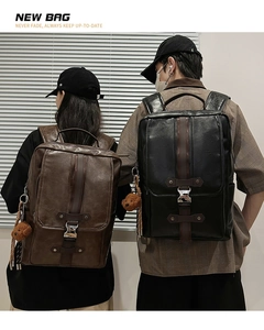 Detail view of vintage PU leather backpacks in black and brown with metal buckles
