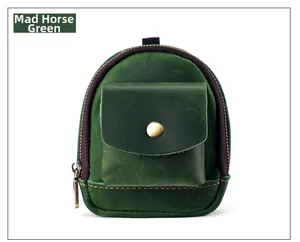 Detail view of Crazy Horse green leather mini waist bag with retro zipper and snap pocket