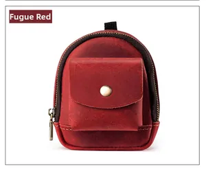 Detail of crazy horse red leather waist bag with vintage metal buckle and zipper
