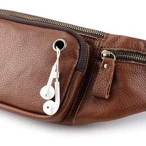 Brown leather waist bag with built-in headphone port and vintage metal zippers