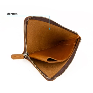 Detailed interior view of a brown crazy horse leather wallet showing the zip pocket