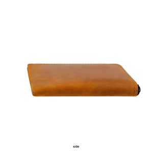 Side view of brown genuine crazy horse leather wallet showing compact thickness and stitching