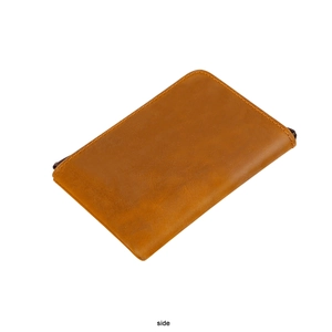 Side view of brown crazy horse leather wallet showing zipper closure and stitching