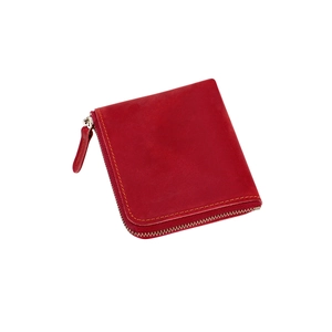 Detail of short leather zipper wallet with red matte finish and yellow stitching