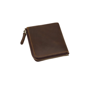 Macro detail of crazy horse leather texture and metallic L-shaped zipper on wallet