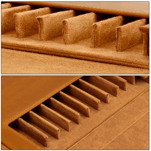 Detailed macro view of brown crazy horse leather pen case with soft suede inner lining slots