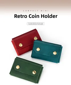 Detailed view of three vintage leather business card holders with dual metal snap closures