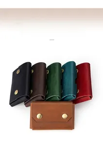 Various colors of leather card holders with dual vintage gold metal snap buttons
