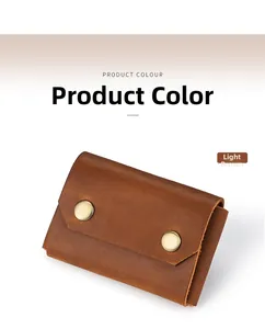 Detailed close-up of a vintage brown leather card holder with dual gold snap buttons