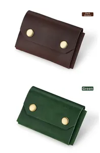 Close-up of vintage crazy horse leather card holders in dark brown and green colors