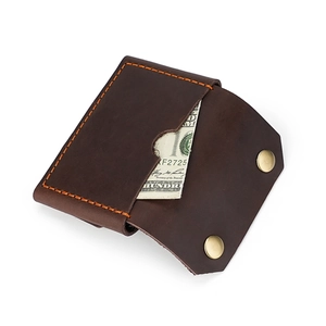 Vintage brown leather business card holder with dual snap buttons and contrast stitching