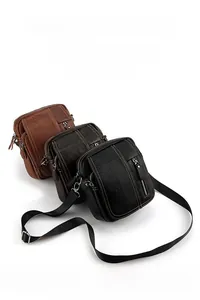 Detailed view of leather crossbody bags in black and brown with multi-layer storage
