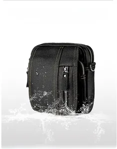 Waterproof cross-body bag made of black textured cowhide leather with yellow stitching