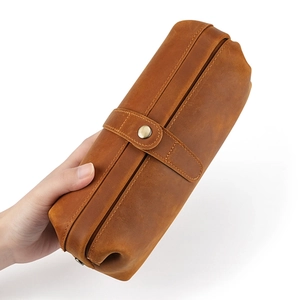 Handheld vintage brown genuine leather toiletry bag with buckle and rustic texture
