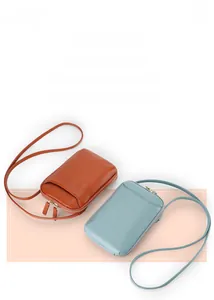 Mini genuine leather crossbody phone bags in orange and light blue with pebble texture