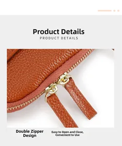 Detail shot of brown lychee leather mini crossbody bag with double gold zippers