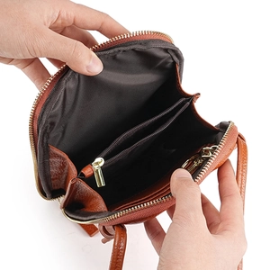 Brown genuine leather mini crossbody bag with multi-layer interior storage and card slots