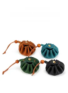 Detailed view of handmade crazy horse leather drawstring coin purses in four colors