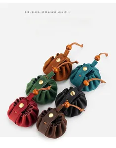 Group shot of colorful drawstring leather pouches with metal snaps and wood beads