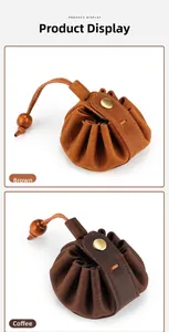 Detail of vintage crazy horse leather drawstring coin pouches in brown and coffee