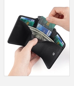 Close-up of black lychee grain leather wallet showing RFID multi-card slots and cash